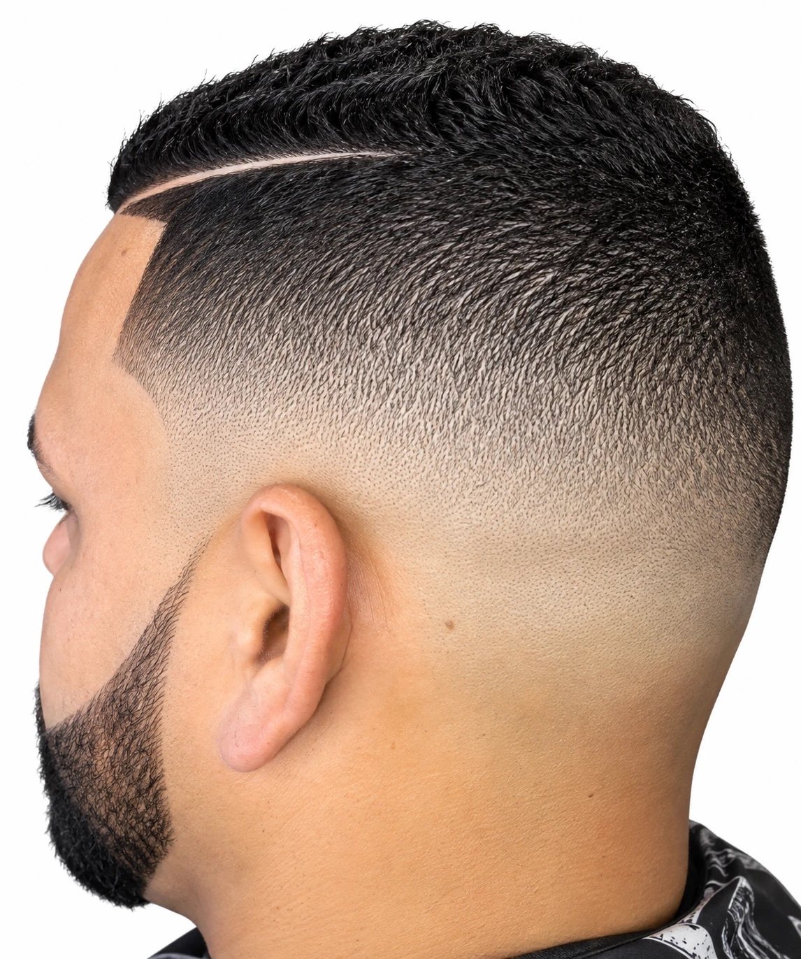 High fade with hard part and beard